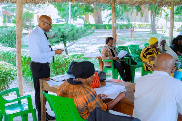 Participants taking part in a facilitated stakeholder consultation in Tanga